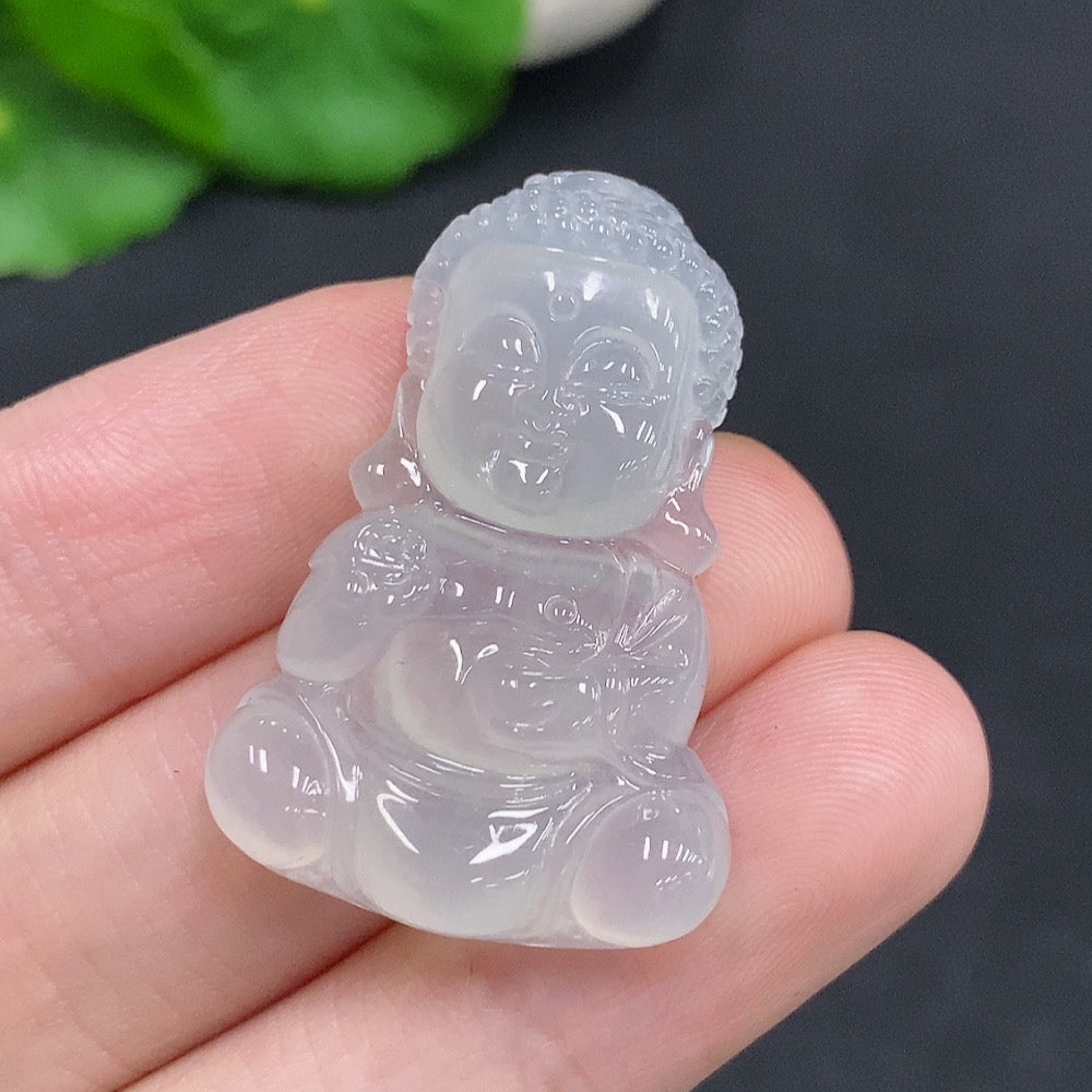 Jadeite Baby Buddha pendant from HUILIU HQ, carved in jade, weighing approximately 7.5g, shown in detailed close-up.
