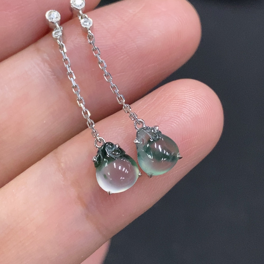 HUILIU HQ jadeite ear studs with 18K gold and diamond accents, featuring polished green jade stones and delicate gold settings.