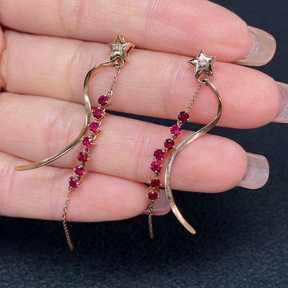 HUILIU HQ ruby gemstone earrings set in 18k gold with diamond accents, featuring vibrant red rubies and sparkling diamonds.