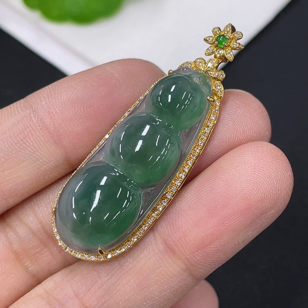 Huiliu Jadeite lucky bean pendant with inlaid diamond accents, featuring intricate craftsmanship and vibrant green jade jewelry.