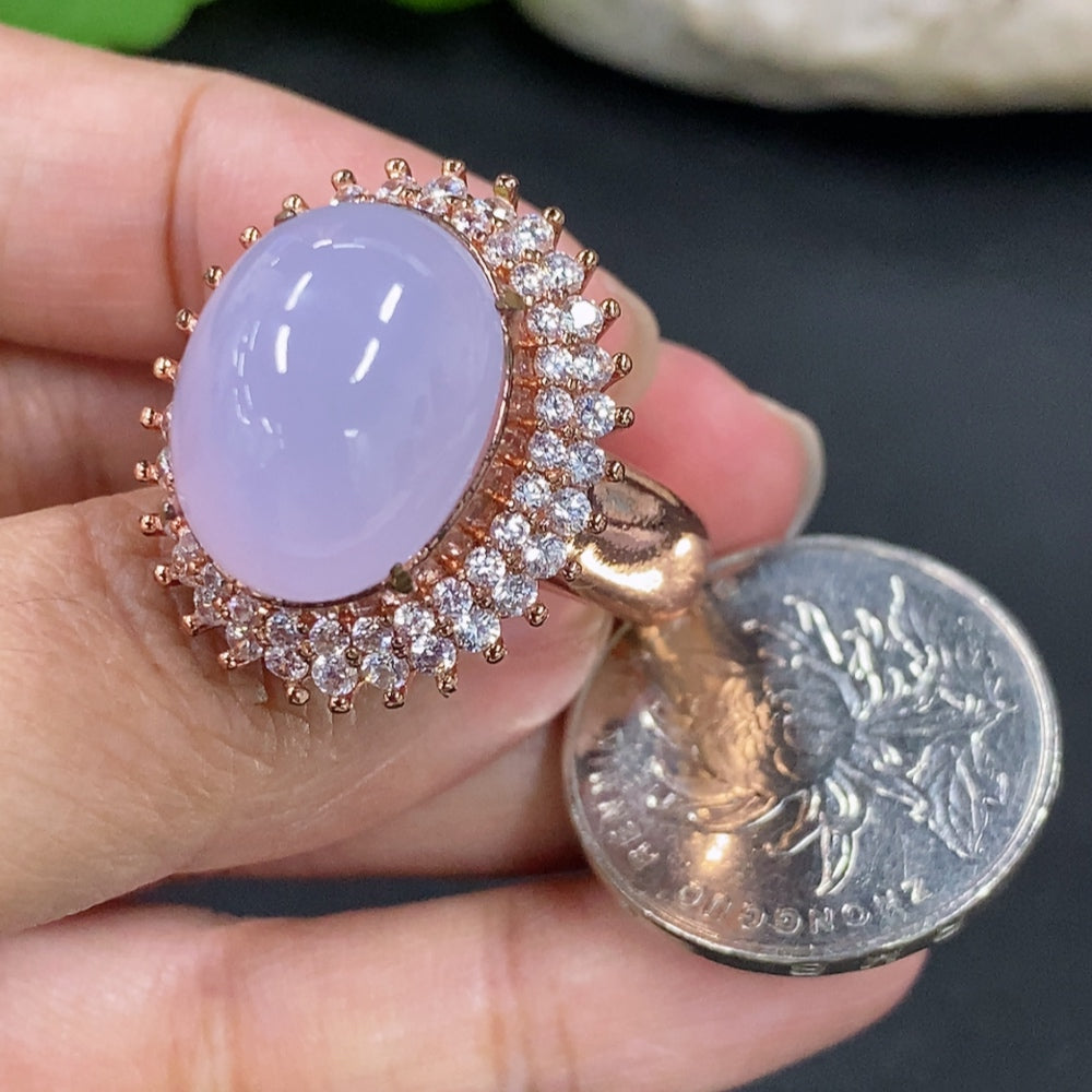 Jadeite cabochon with non-gold inlay, smooth polished surface, weighing approximately 20.8g, from HKHQ.