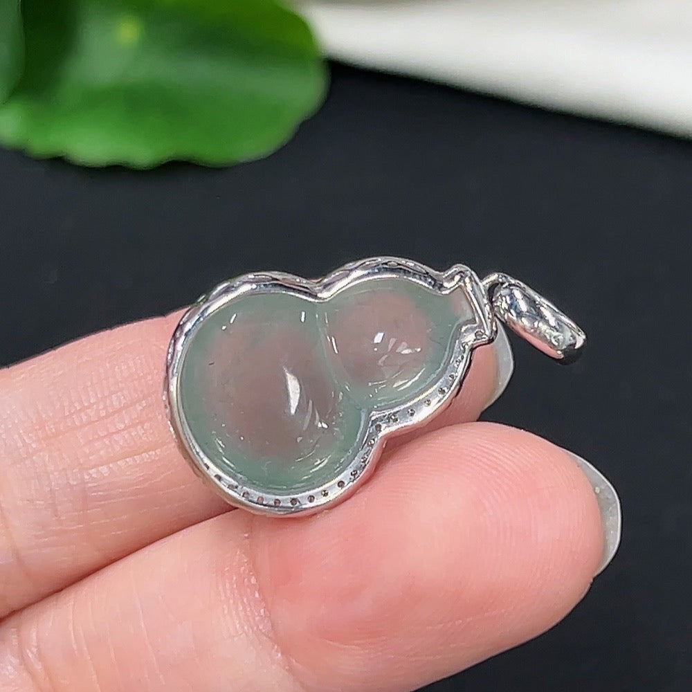Jadeite gourd pendant in 9k gold with diamond accents, displayed on a necklace chain, weighing approximately 4.78g.