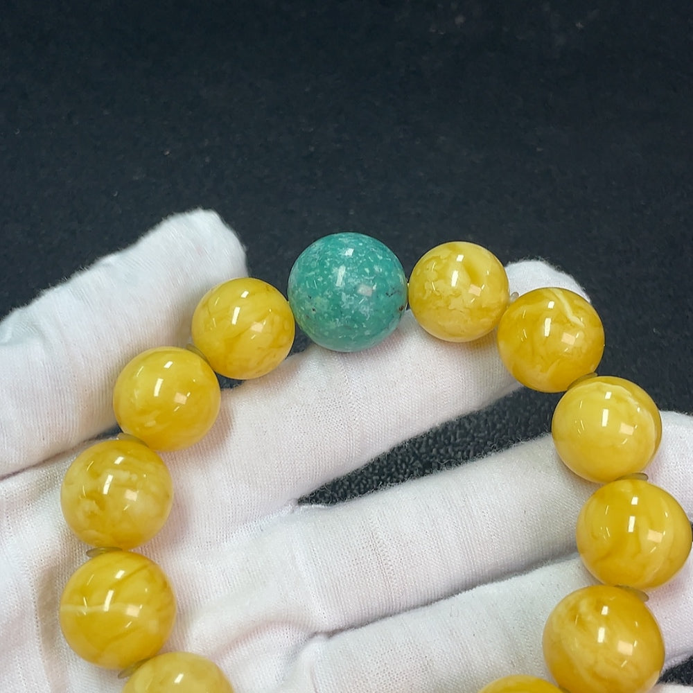 Amber beeswax bracelet by HUILIU HQ featuring non-natural accent stones, approximately 16.2mm in size and weighing about 40.13g.