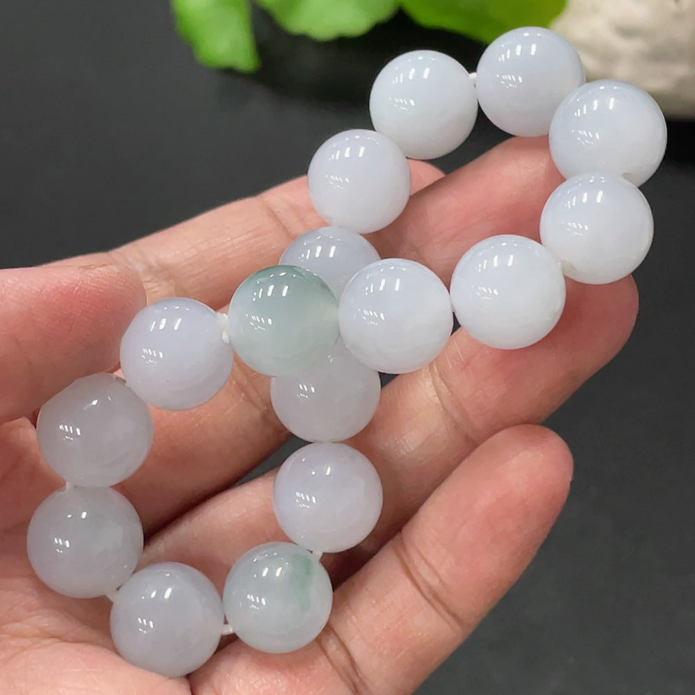 Huiliu Jadeite bracelet, 12.4mm wide, featuring polished green jade beads, certified by Huiliu, displayed on a neutral background.