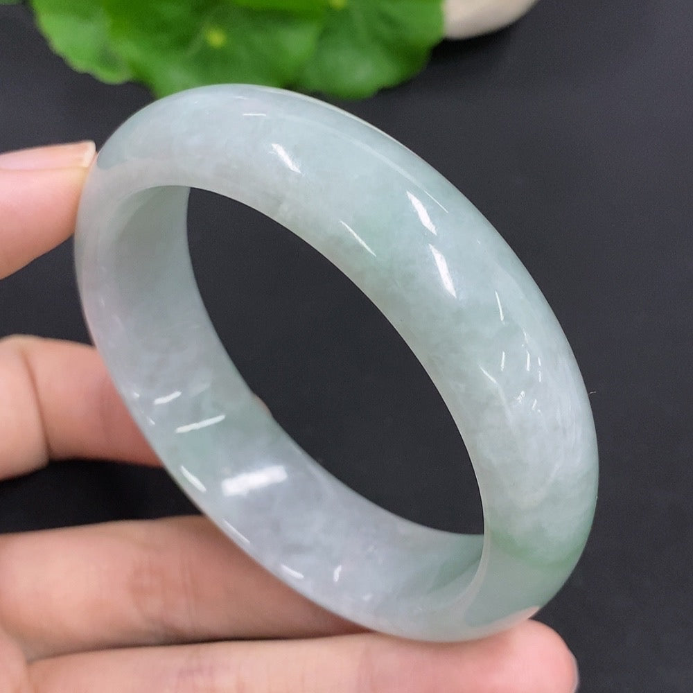 Jadeite round bangle with a total weight of 64.6g and size 54.5, featuring smooth, polished jadeite from HKHQ.