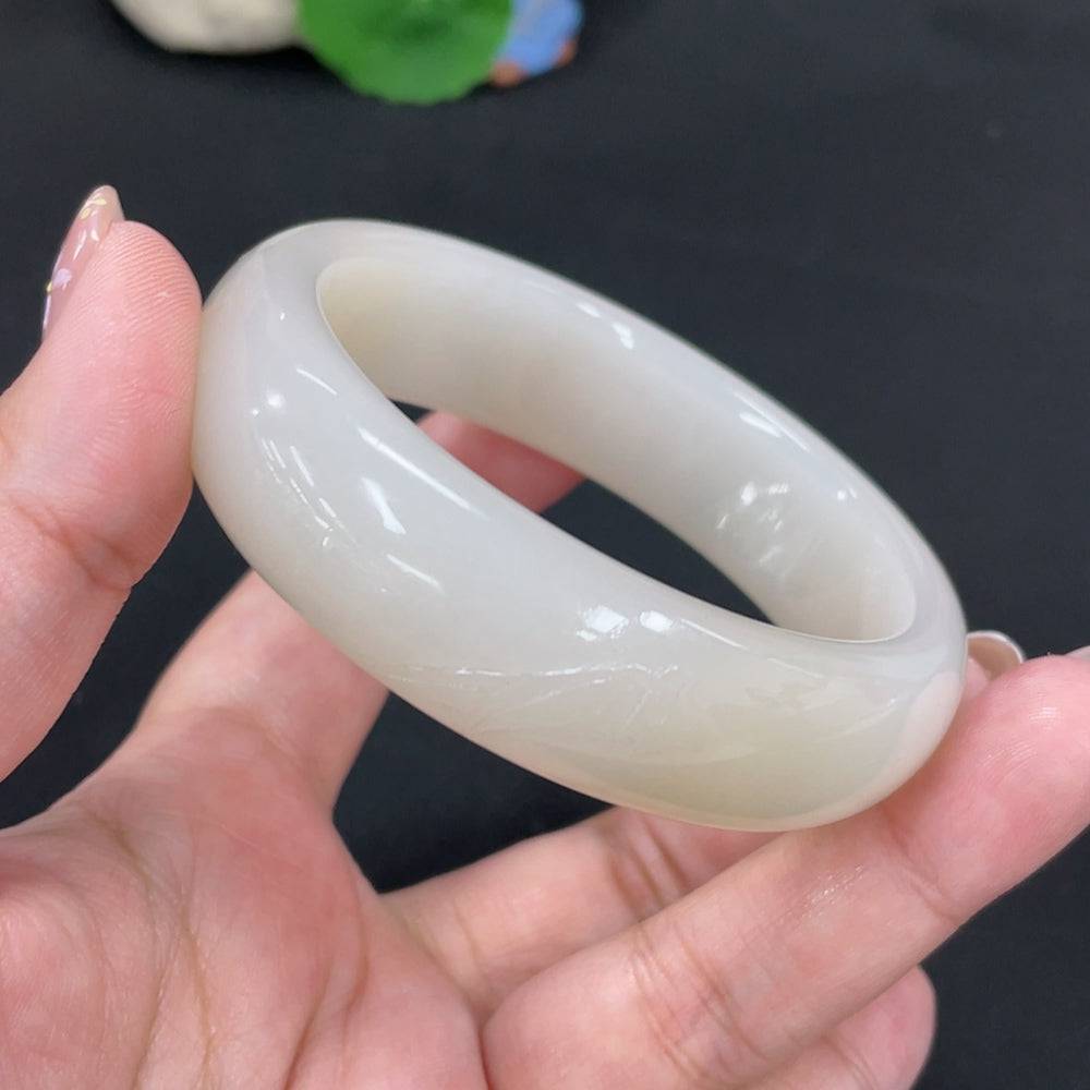 Huiliu certified Hetian jade round bracelet featuring smooth, polished green jade beads on a string.