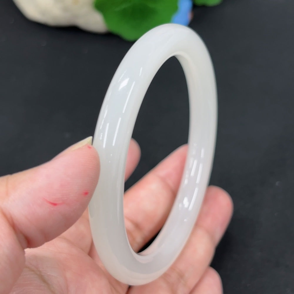 HKHQ Hetian Jade round bangle, size 59.9, weighing approx. 42.6g, featuring smooth, polished jade surface and traditional craftsmanship.