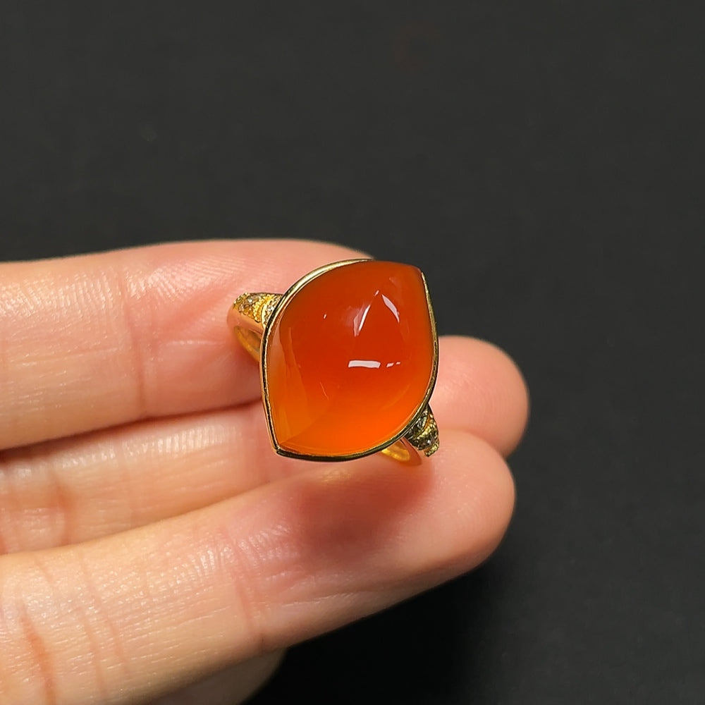 18K gold Southern Red Agate ring with diamond accents, showcasing a vibrant red stone set in a luxurious gold band.