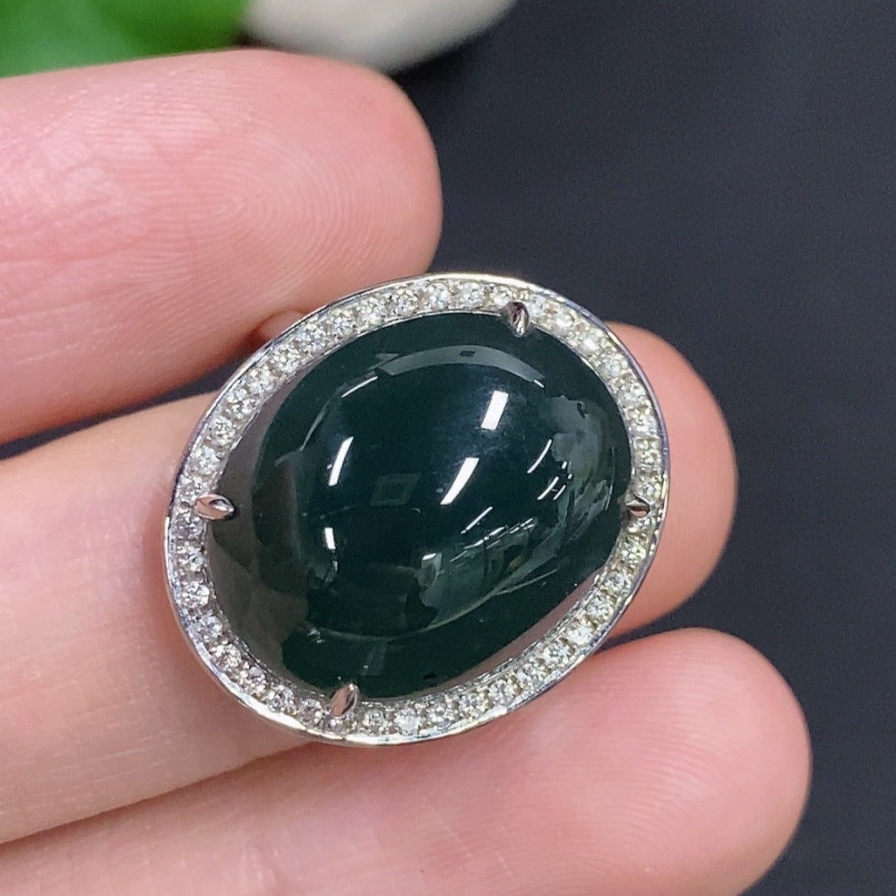 Jadeite cabochon ring with diamond accents in 18k gold, size 14, weighing approximately 7g, featuring a smooth polished jade stone.