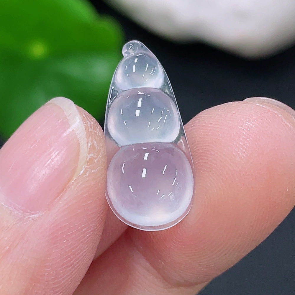 Jadeite lucky bean pendant from HKHQ, crafted from green jade, weighing approximately 1.17g, featuring smooth polished surface.
