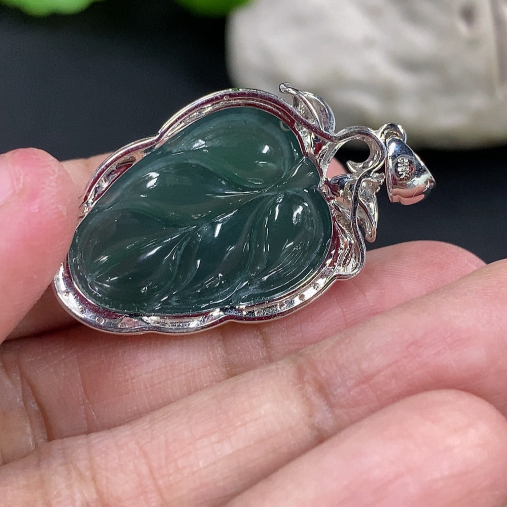 Jadeite leaf inlay pendant with 18K gold and diamond accents, elegant necklace from HKHQ featuring intricate design and craftsmanship.