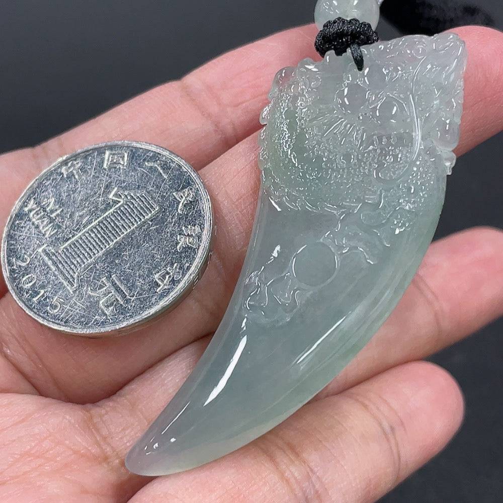 Huiliu Jadeite pendant featuring a carved dragon tooth design on a rope, certified jade jewelry accessory.