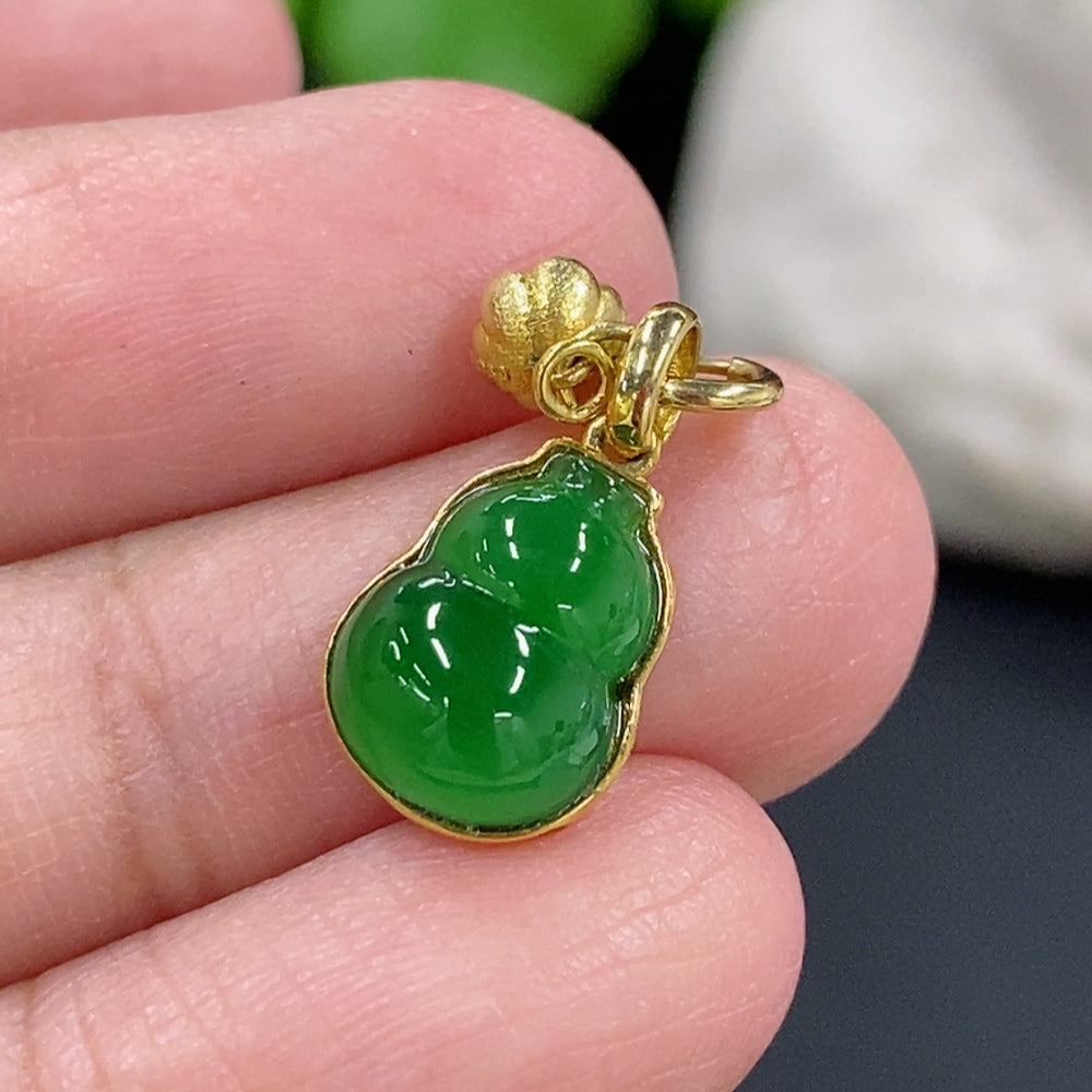 Jadeite gourd pendant necklace with 18K gold chain, featuring a smooth green jadeite gourd charm on a delicate gold chain.