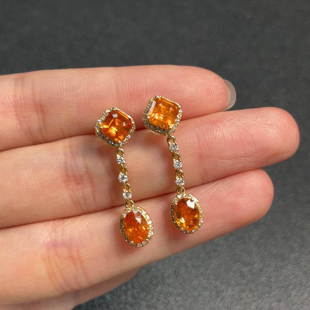Huiliu gemstone garnet earrings with diamond accents, featuring rich red garnets and sparkling diamonds in a crafted jewelry design.