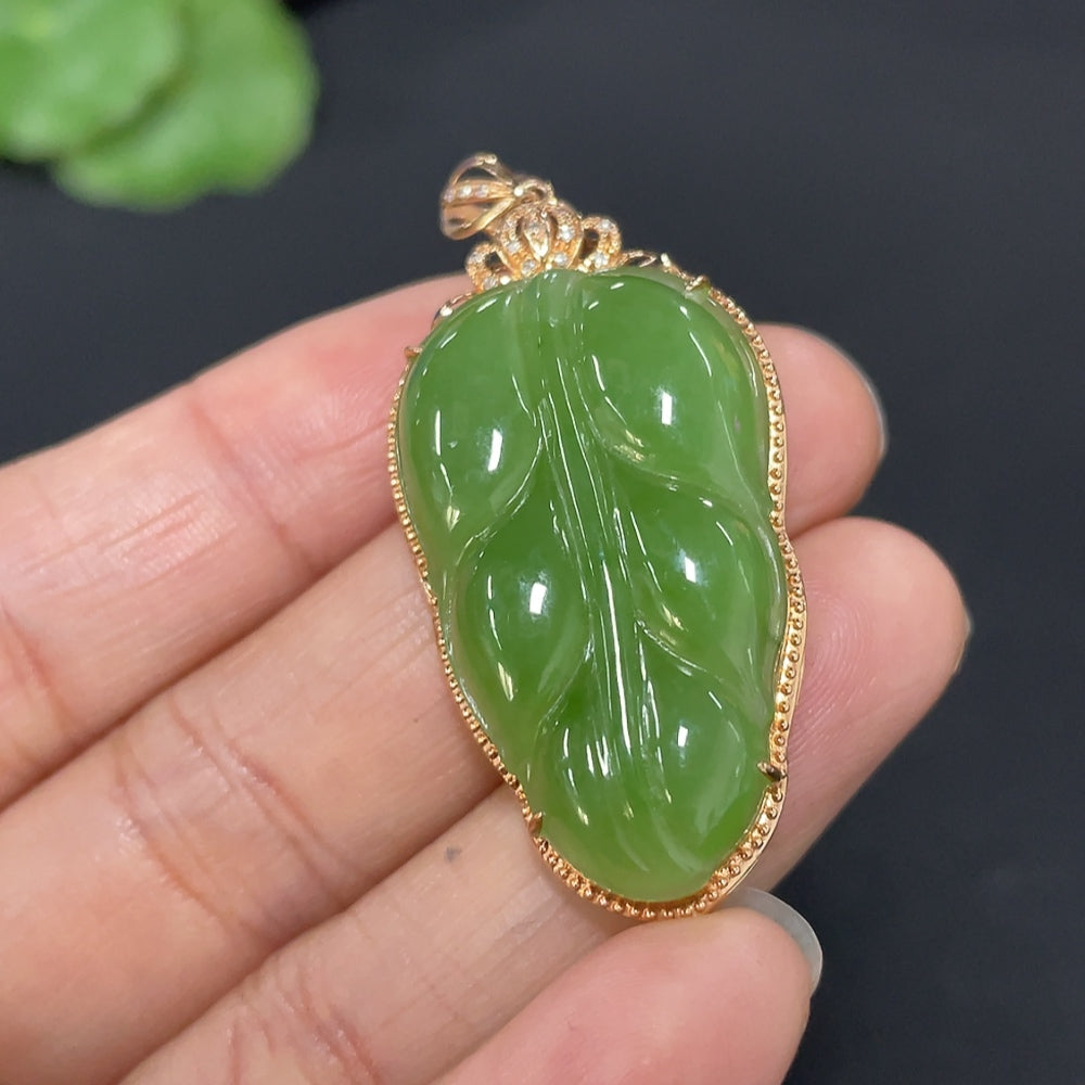 Hetian Jade Jasper leaf pendant with 18k gold inlay and diamond accents, weighing approximately 5.3 grams, by HUILIU HQ.