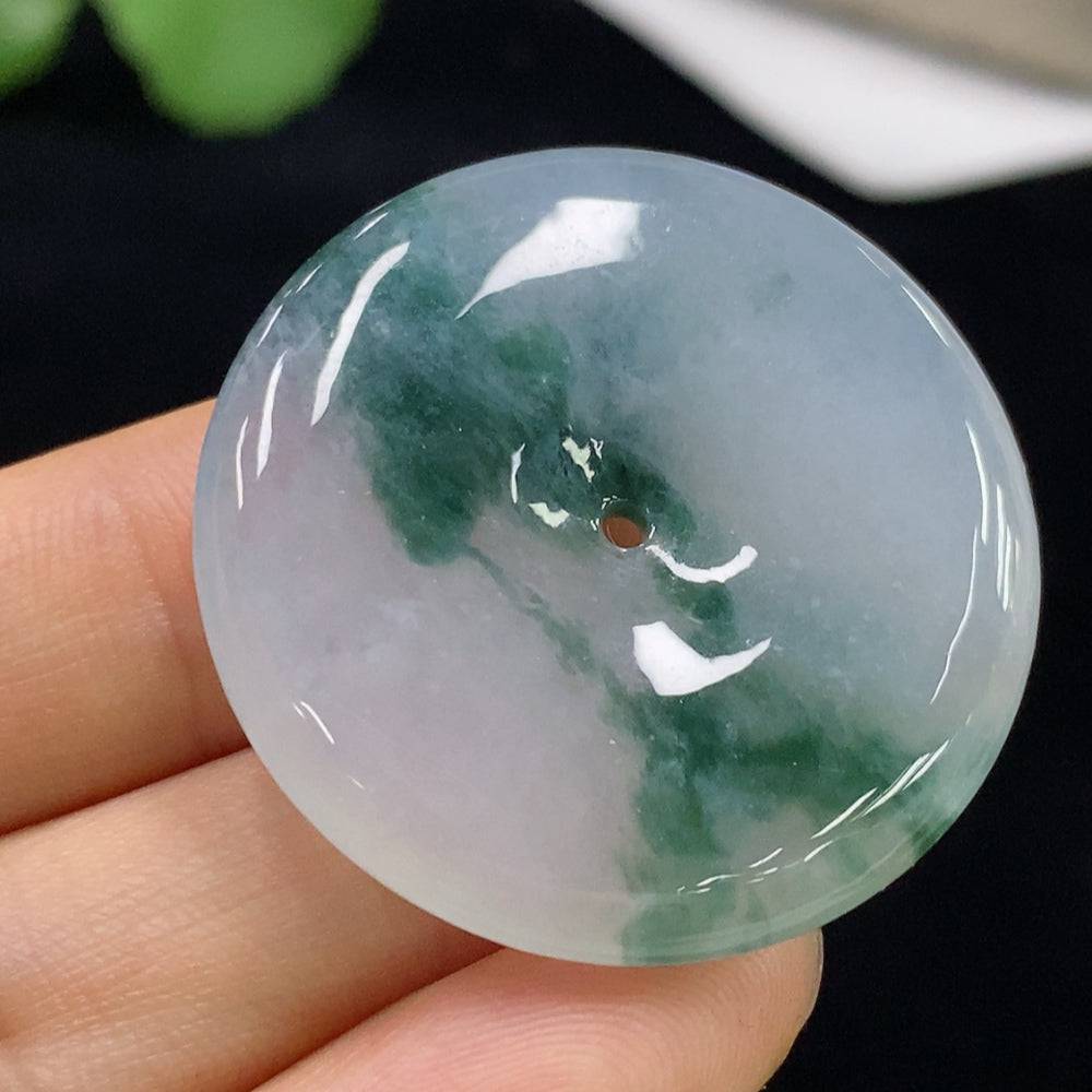 Huiliu certified jadeite Peace Knot pendant featuring intricate design, showcasing smooth, polished green jade gemstone.