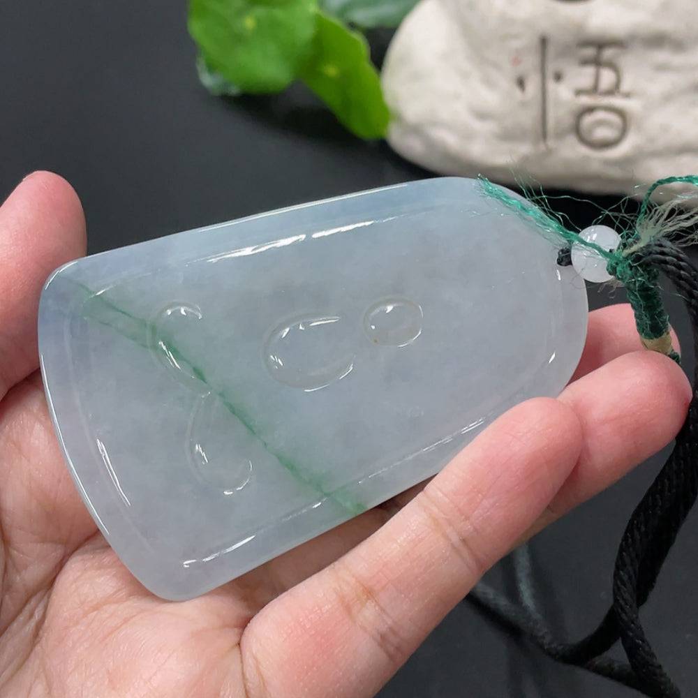 Jadeite Guanyin pendant in jade, crafted by HUILIU HQ, weighing approximately 51.47g, featuring detailed carved figure.