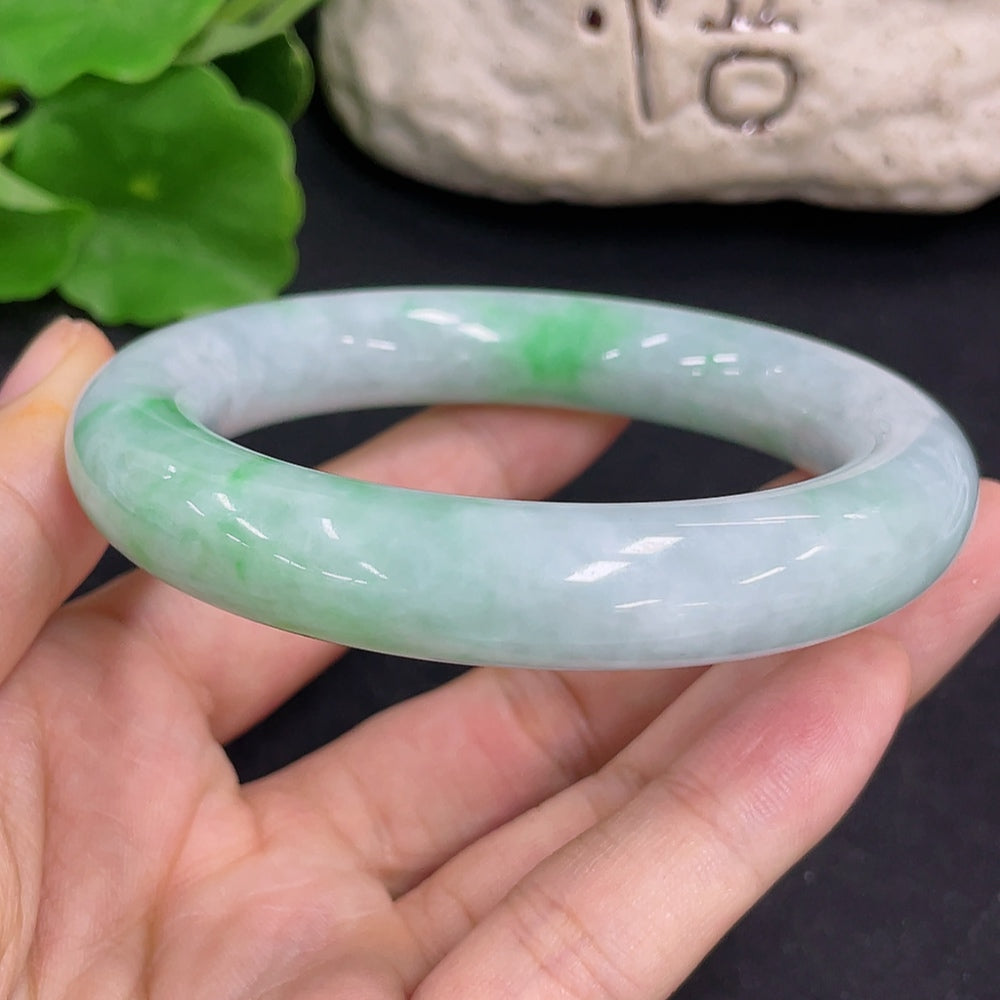HKHQ jadeite round bangle with approximate weight 80.5g and size 56.2, showcasing smooth jade surface and elegant circular design.