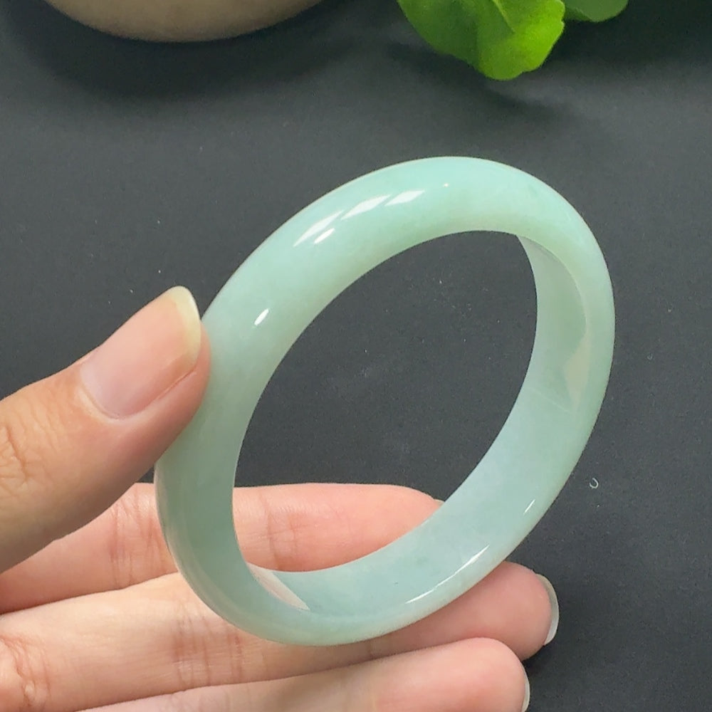 Jadeite round bangle in size 55.8 with a total weight of 45.69g, crafted by HKHQ, showcasing smooth, polished jade jewelry.