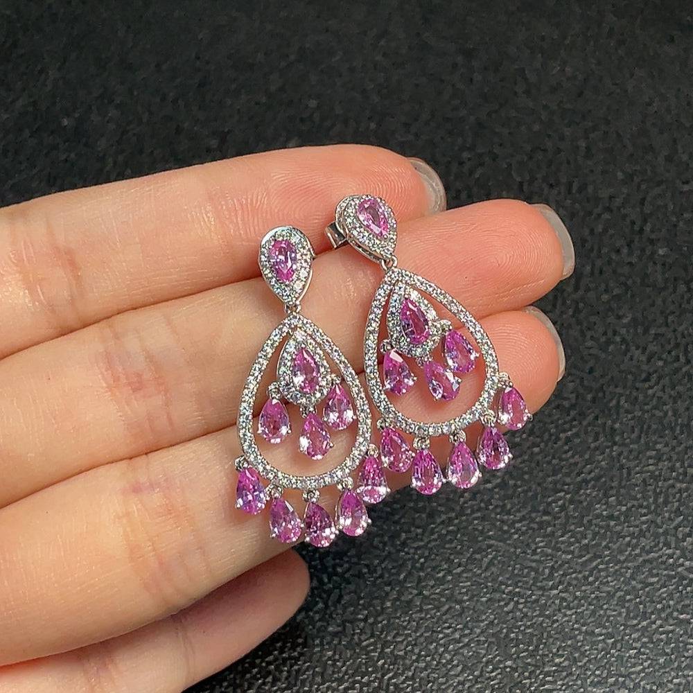 Huiliu Blue Sapphire earrings featuring vibrant blue gemstones set in elegant jewelry design