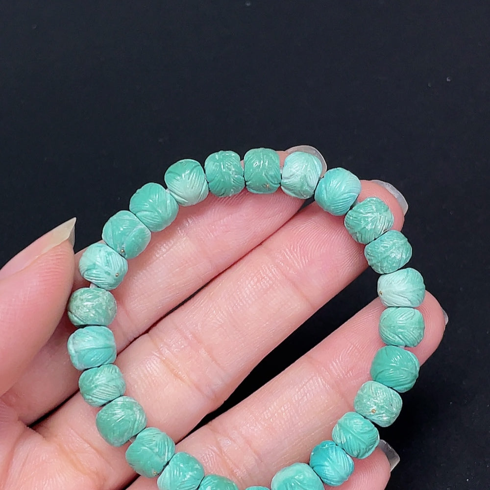 Turquoise gemstone bracelet by HKHQ featuring small metal beads, approximately 7.4mm wide, with a total weight of 11.29g.