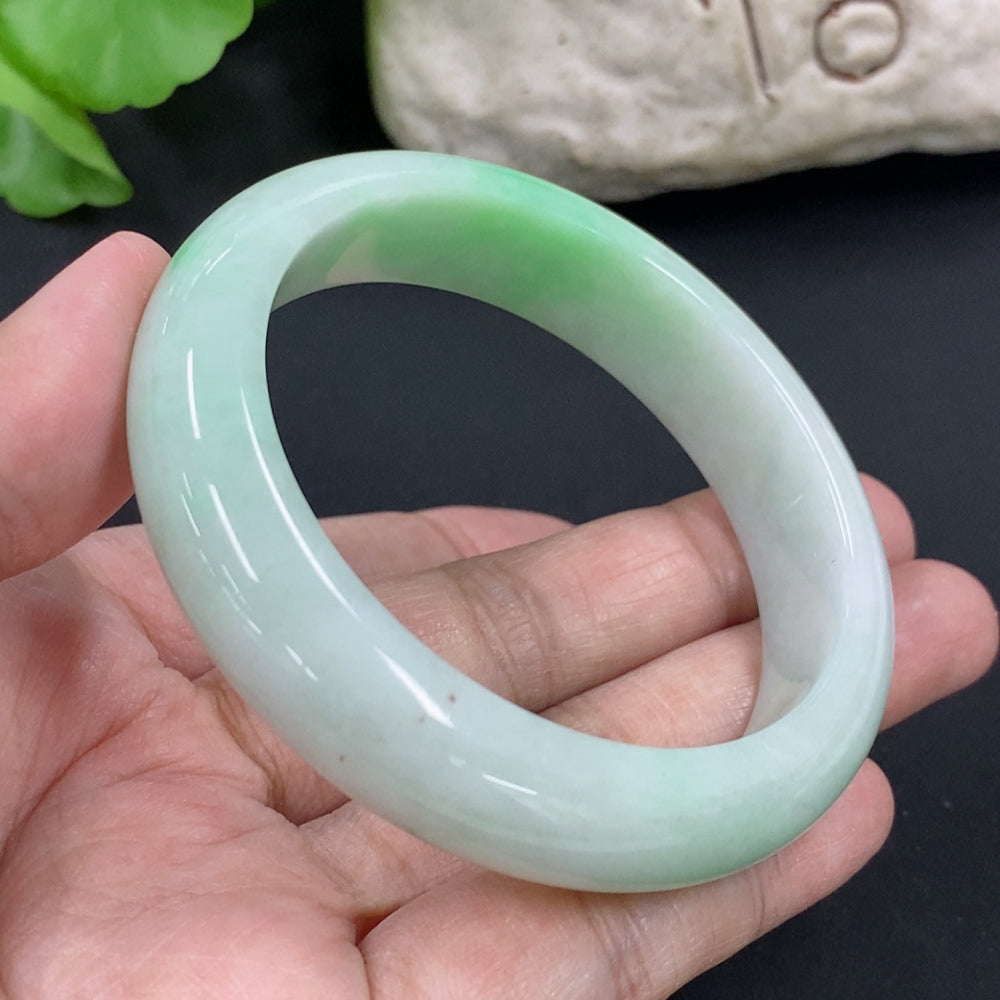 HKHQ jadeite round bangle in size 53.8 with a 56.6g weight, showcasing smooth, polished jadeite craftsmanship.