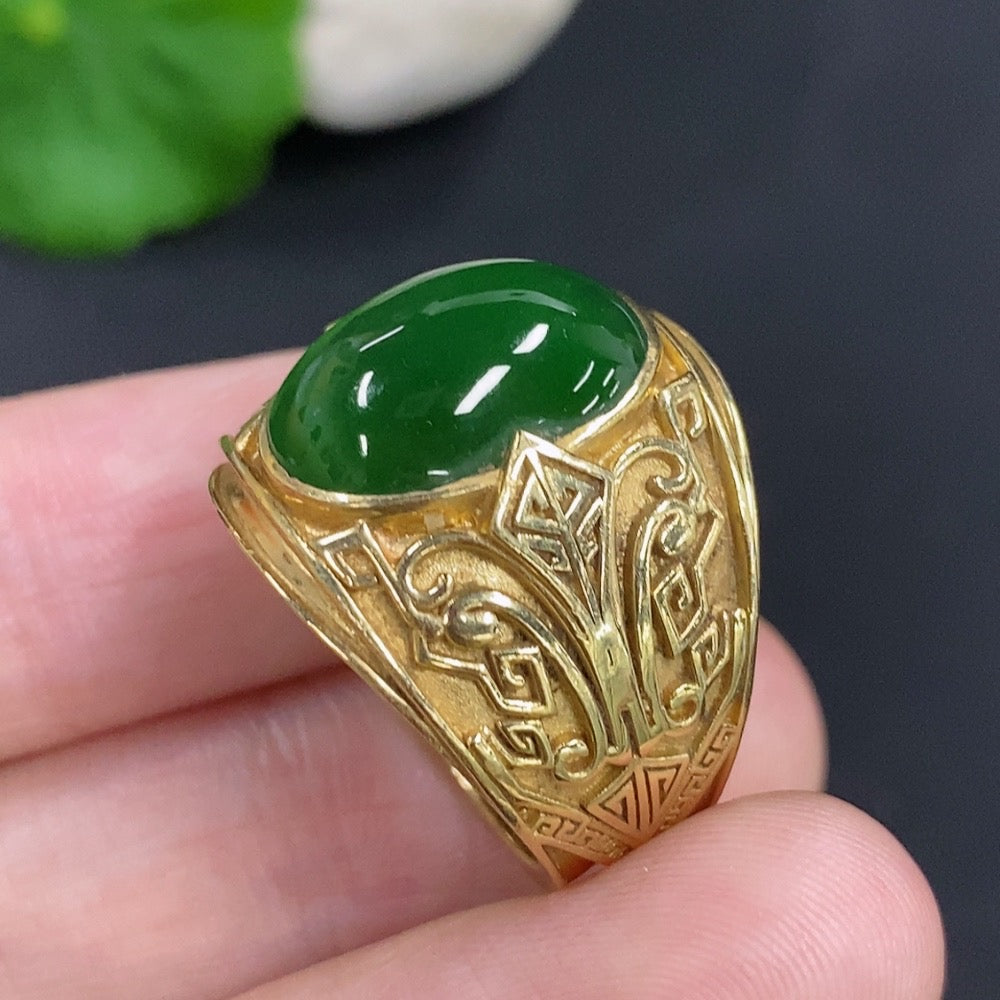 Elegant jadeite cabochon ring with 18K gold band by HKHQ, showcasing a smooth, polished green gemstone on a delicate gold setting.