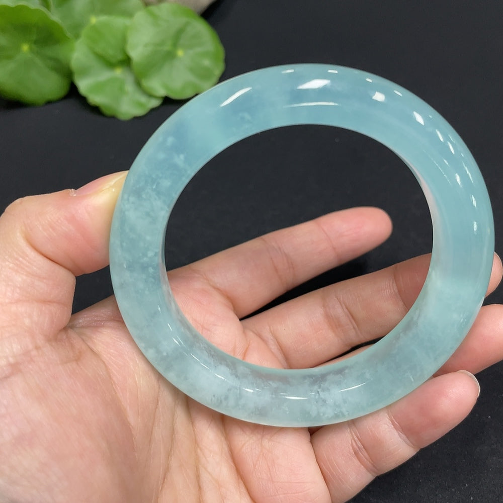 Huiliu Celestial Blue Frost Jade bracelet with circular serpentine jade beads, Huiliu certified, showcasing smooth, polished jewelry.