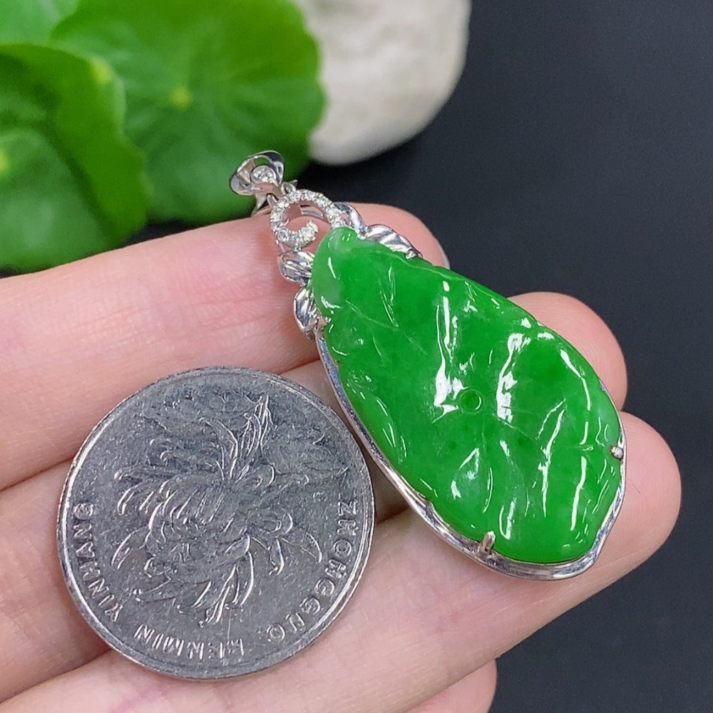 Jadeite lotus leaf pendant with 18K gold accents and diamond details, weighing approximately 4 grams, by HKHQ.