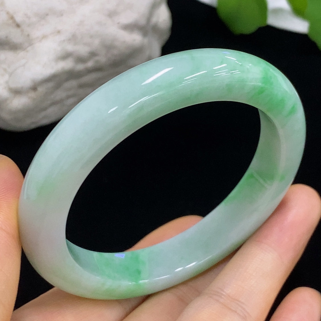 HKHQ jadeite round bangle, 57.1g, size 55.4, showcasing smooth, polished green jade with a glossy finish.