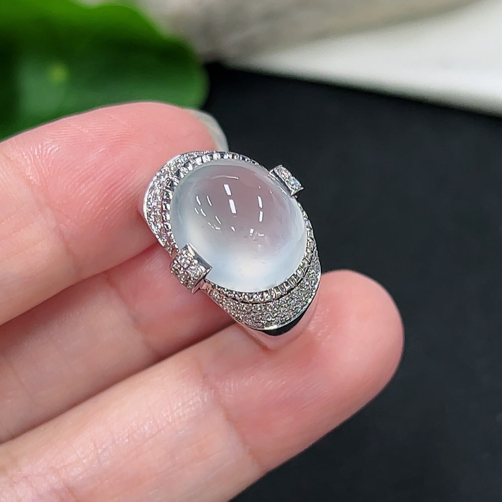 Elegant jadeite inlaid ring with diamond accents in 18K gold, showcasing intricate craftsmanship and luxurious jewelry design.