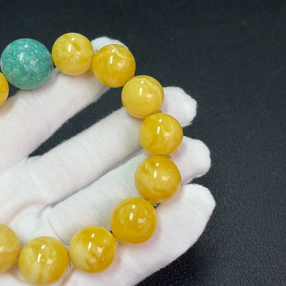 Amber beeswax bracelet by HUILIU HQ with accent stones, 16.2mm size, weighs approximately 40.13g, featuring natural amber and decorative stones.