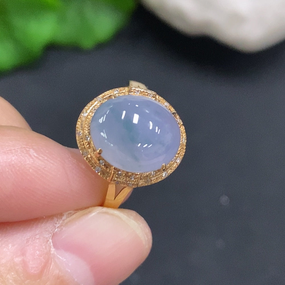 Huiliu Jadeite cabochon ring accented with diamonds, featuring a polished jade gemstone in a silver setting.
