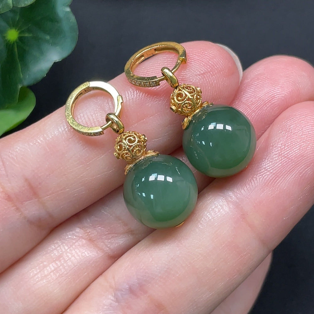 HKHQ Hetian jade earrings with 18K gold and diamond accents, 11.6mm size, showcasing intricate craftsmanship and luxurious design.