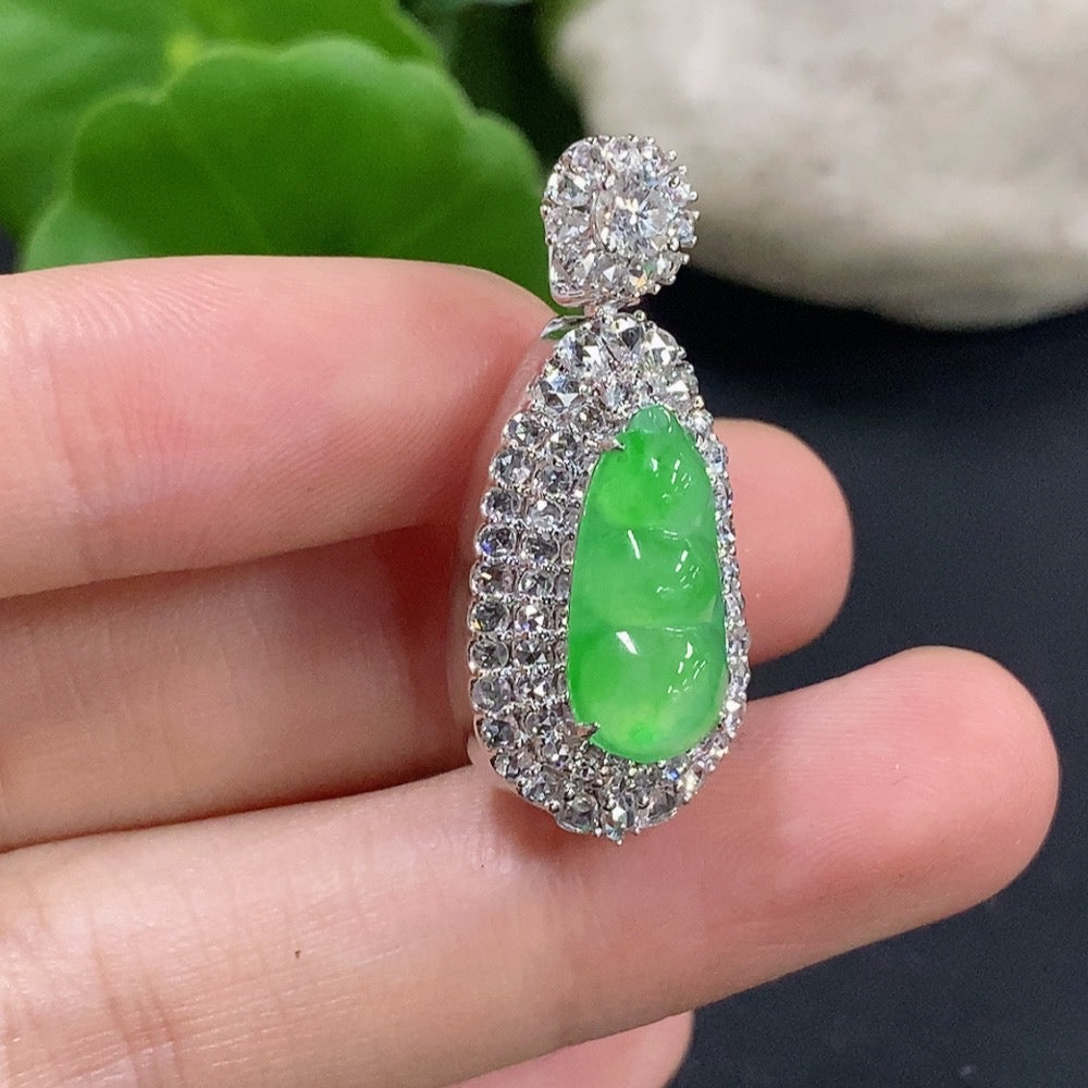 Jadeite lucky bean pendant necklace with 18K gold and diamond accents, featuring a polished jadeite bead and intricate gold detailing.