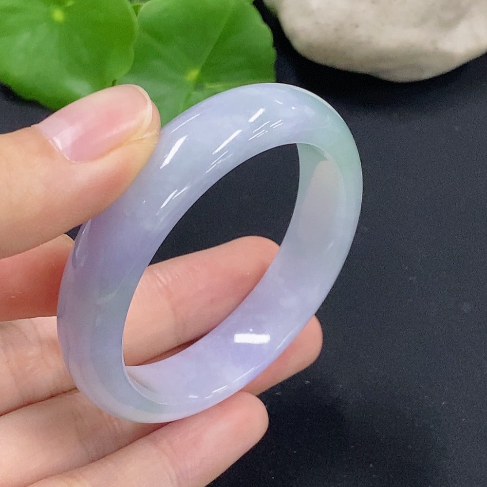 HKHQ jadeite oval bangle bracelet in size 50.2 with a weight of 33.7g, showcasing smooth, polished green jadeite craftsmanship.