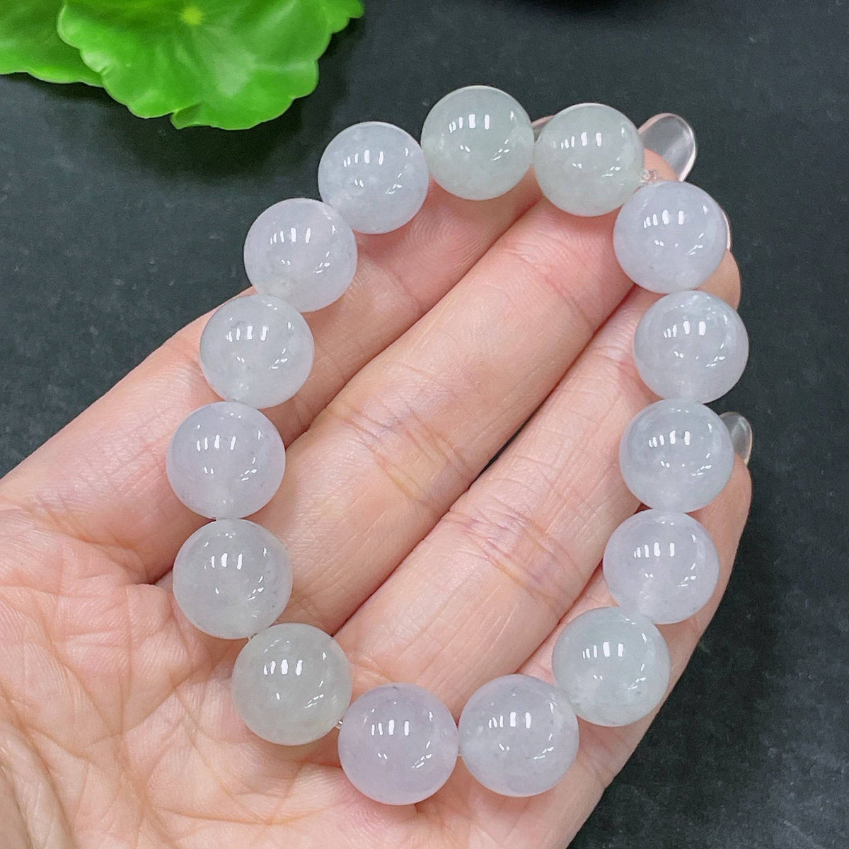 Huiliu Jadeite bracelet with 12.3mm beads, certified jade jewelry, showcasing smooth, polished green jade stones.