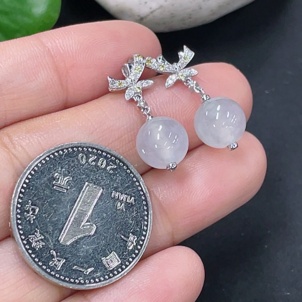 Jadeite earrings set in 18k gold with diamond accents, total product weight approximately 3.07g