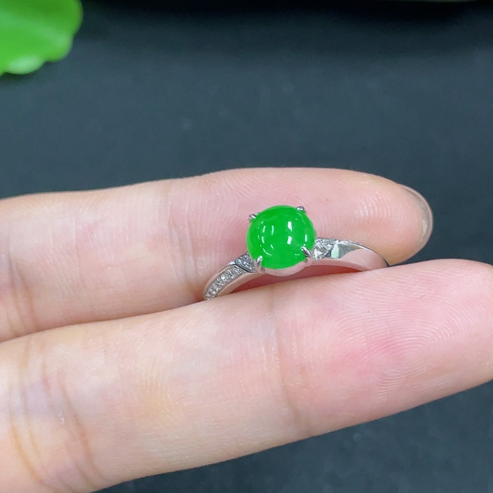 Jadeite ring with 18k gold band and diamond accents, size 13, showing the shank and natural origin markings underneath.