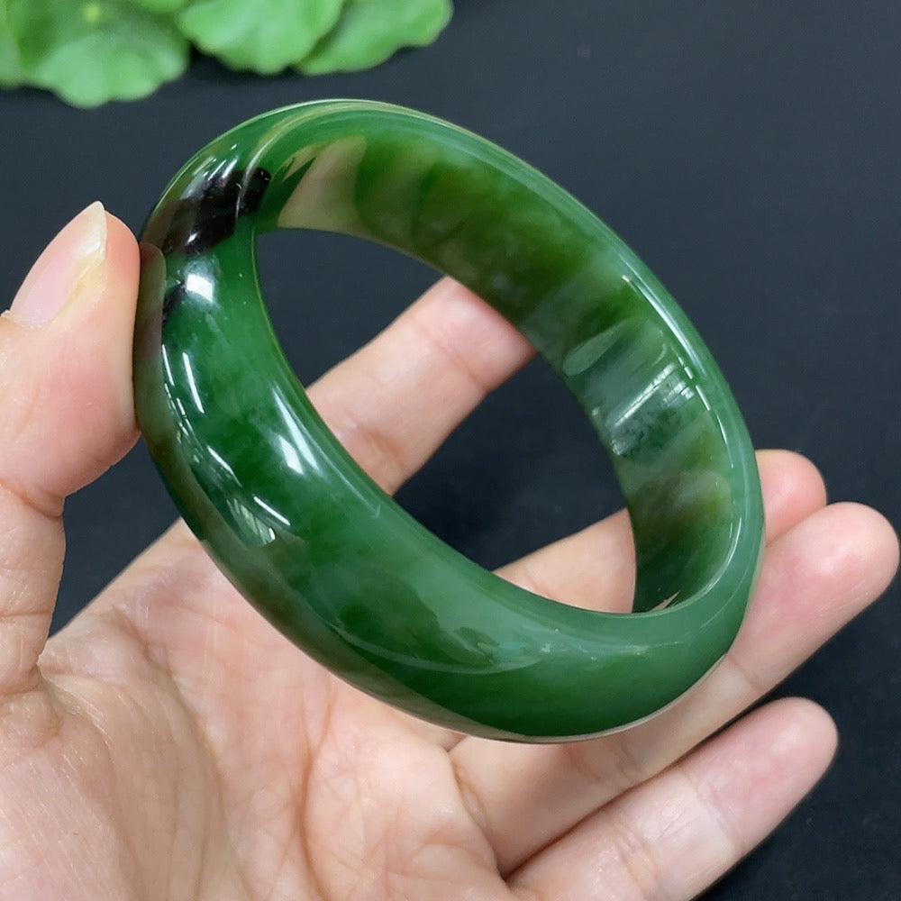 Green Hetian jade round bangle bracelet from HKHQ, featuring smooth polished surface and traditional craftsmanship.