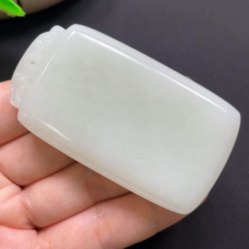 Hetian jade plain pendant from HKHQ, weighing approximately 80.1g, showcasing smooth, polished jade surface with natural green hues.