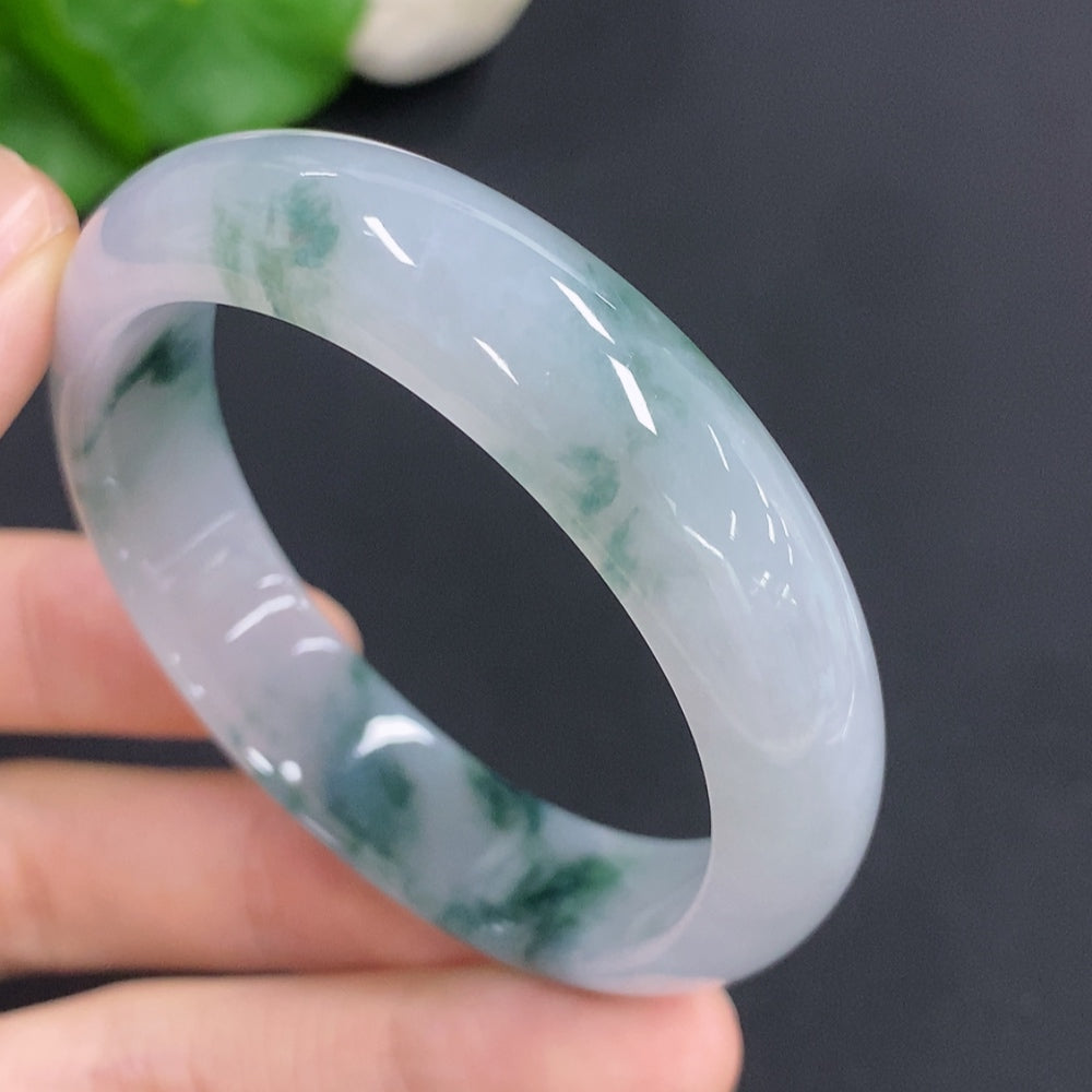 Jadeite concubine bracelet in green jade, size 55.5/47.5, weighing approximately 38g, featuring smooth, polished jade beads.
