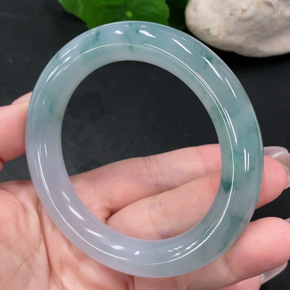 HUILIU HQ jadeite round bangle size 56.8 with approximately 74.9g, showcasing smooth, polished jade surface and rounded design.