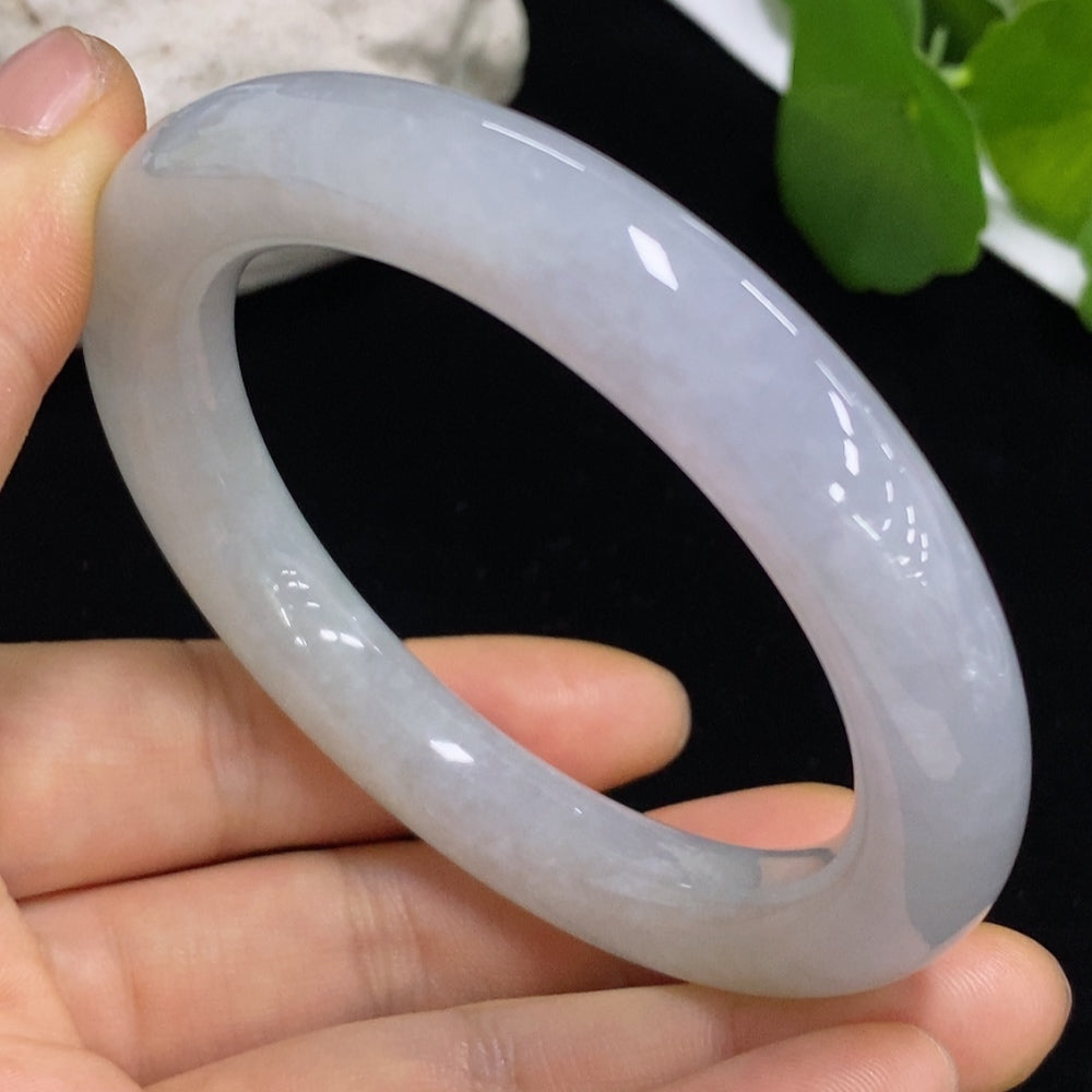 Elegant jadeite round bangle from HKHQ, showcasing smooth, polished jade jewelry with a classic circular design.