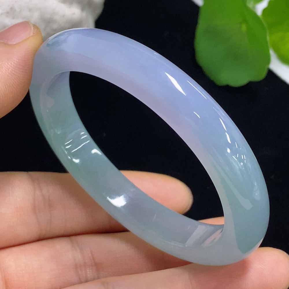 HKHQ jadeite oval bangle in size 53.2 with a weight of 38.2g, showcasing smooth polished jadeite bracelet on a neutral background.