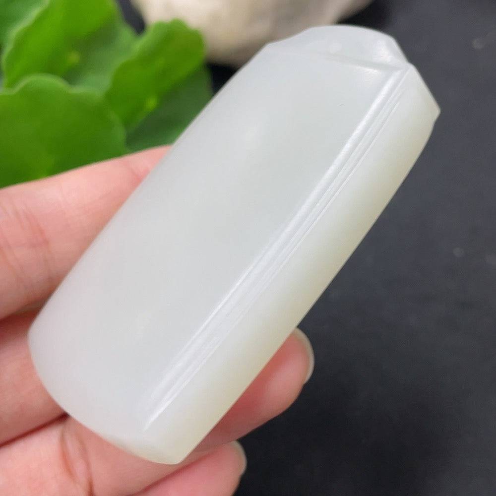 Huiliu certified Hetian jade pendant featuring a plain, smooth jade stone with natural green hue and polished finish.