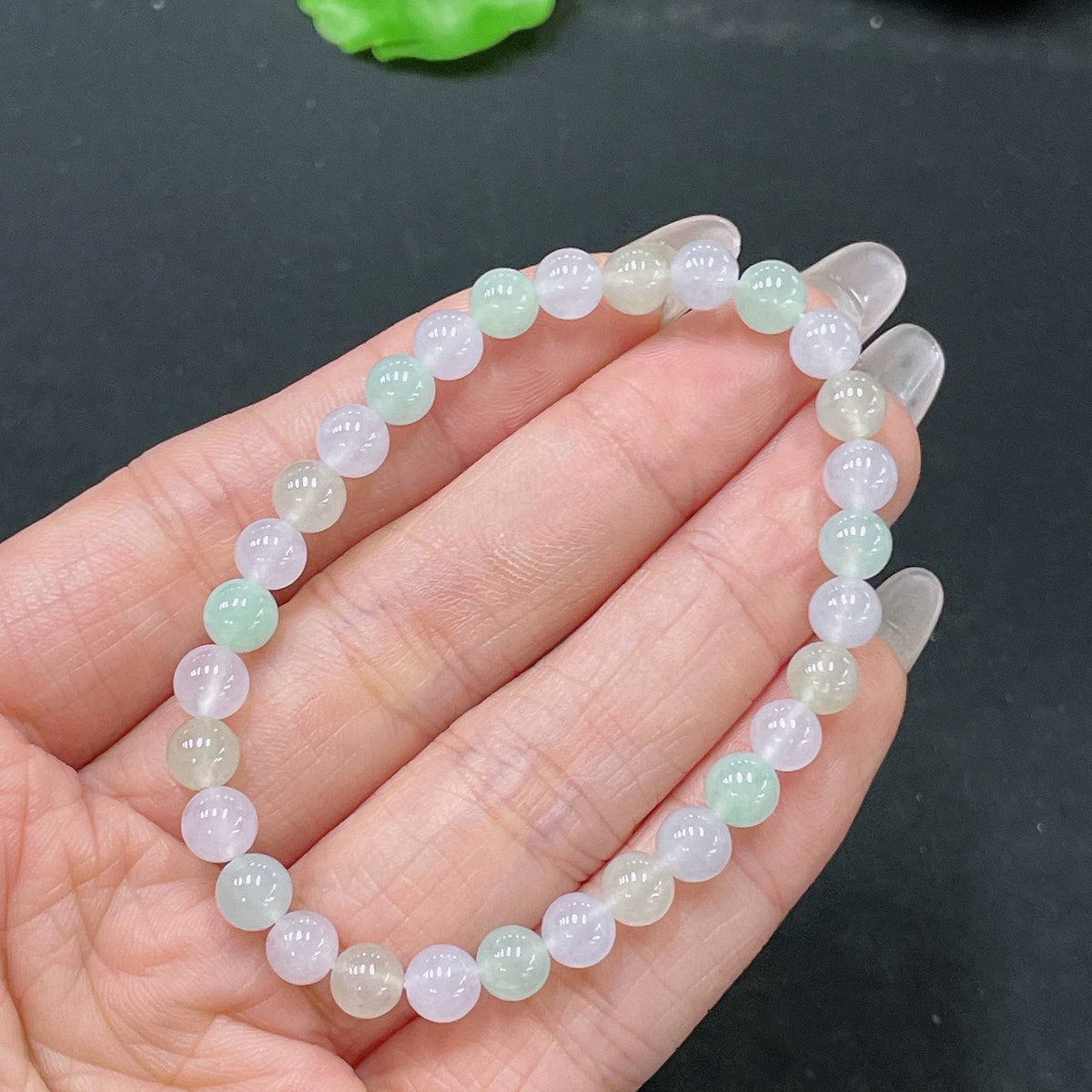 HUILIU HQ jadeite bracelet with 5.6mm beads, total weight 10.12g, featuring smooth, polished green jade stones.