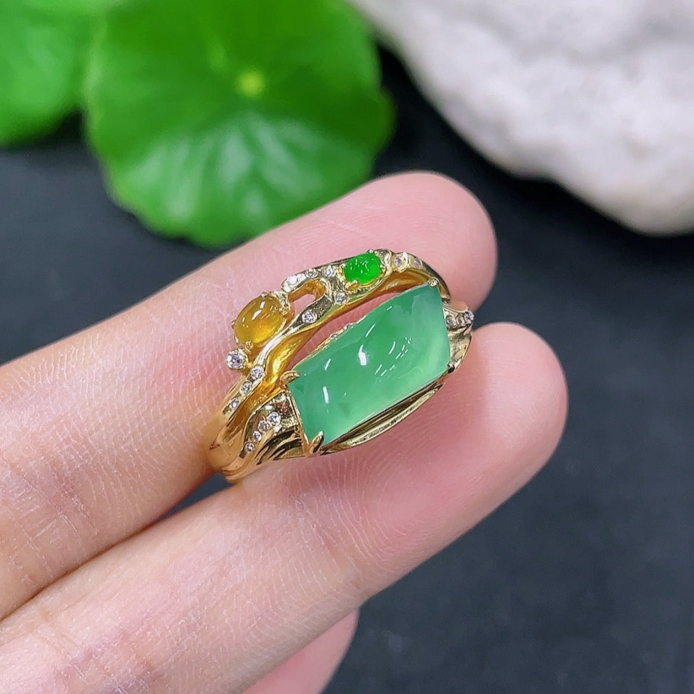 Jadeite ring with 18K gold band and diamond accents, size 16, shown on a white background.