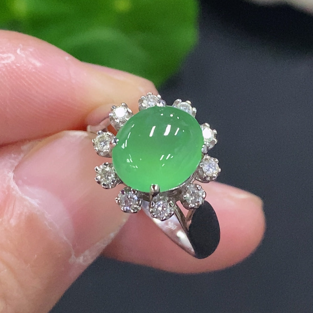 Jadeite cabochon solitaire ring with diamond accents in 18K gold, size 14, featuring a smooth green jade stone and elegant design.
