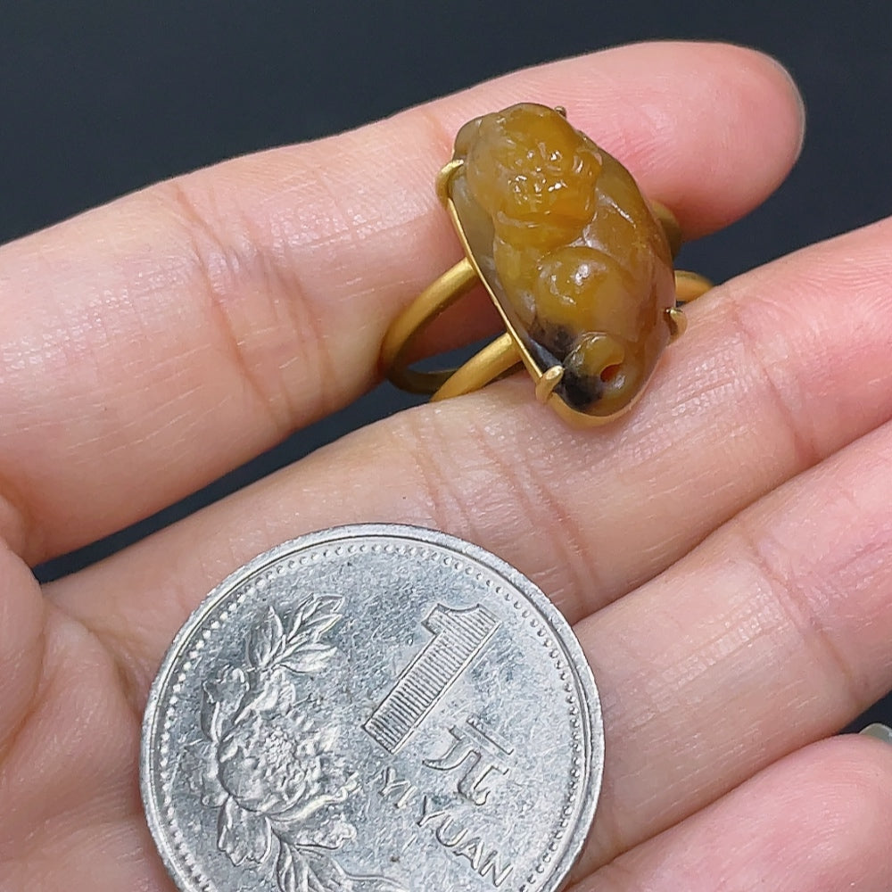 HKHQ Hetian Jade auspicious beast inlaid ring featuring intricate jade carving and detailed craftsmanship.